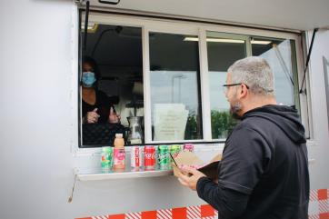 A man ordering at a food truck