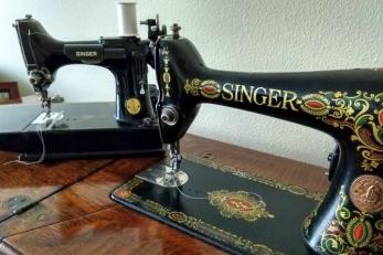 A black delicately painted singer sewing machine