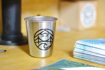 Cup with bridge city kid business logo