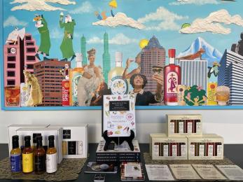 Preservation pantry book displayed next to hot sauces on a table