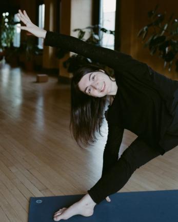 Woman doing yoga in a yoga studio