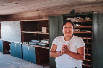 Woman in a storage room.