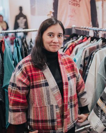 woman standing near clothes racks