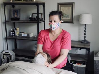Jessica mcgrory, owner of portland massage center, llc, gives a patient massage therapy.
